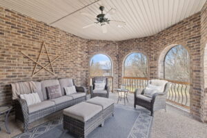 Screened outdoor patio overlooking the backyard at 1069 Windsor Drive, Gallatin, TN.