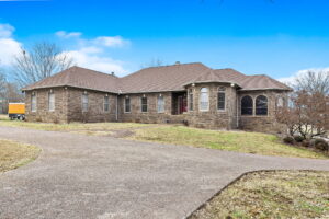 Front view of the home at 1069 Windsor Drive, Gallatin, TN, available at live absolute auction.